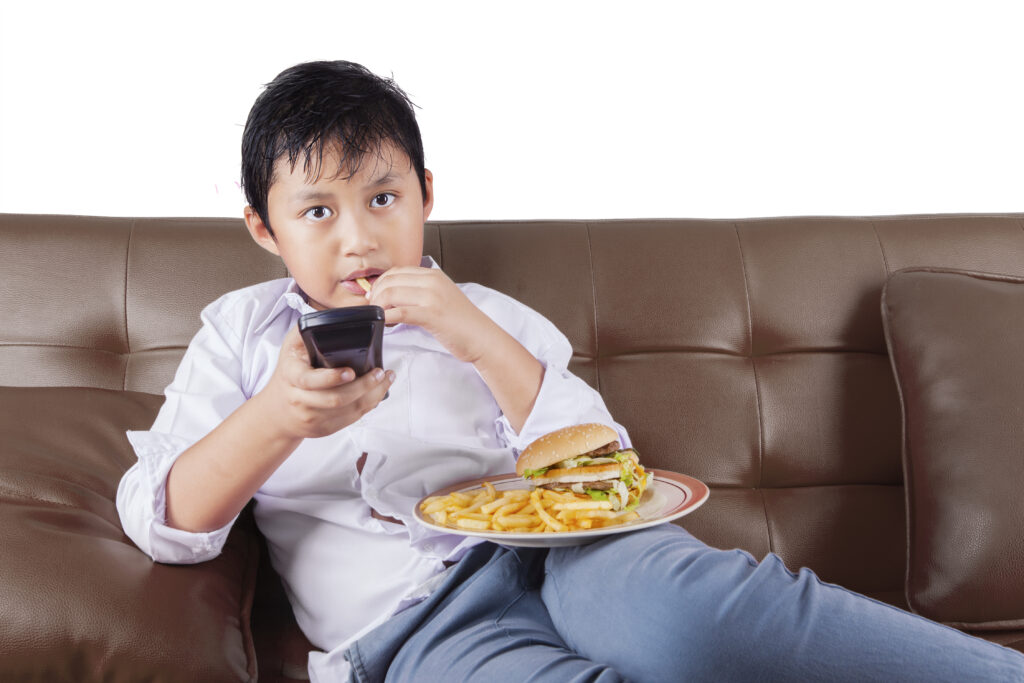 Portrait,Of,A,Cute,Little,Boy,Sitting,On,The,Sofa