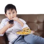 Portrait,Of,A,Cute,Little,Boy,Sitting,On,The,Sofa